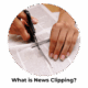 what is news clipping? someone cutting a newspaper article out of a newspaper